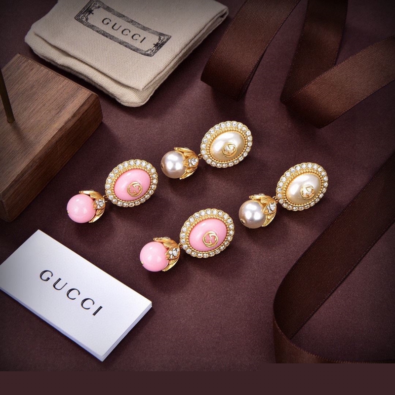G*u*i earrings